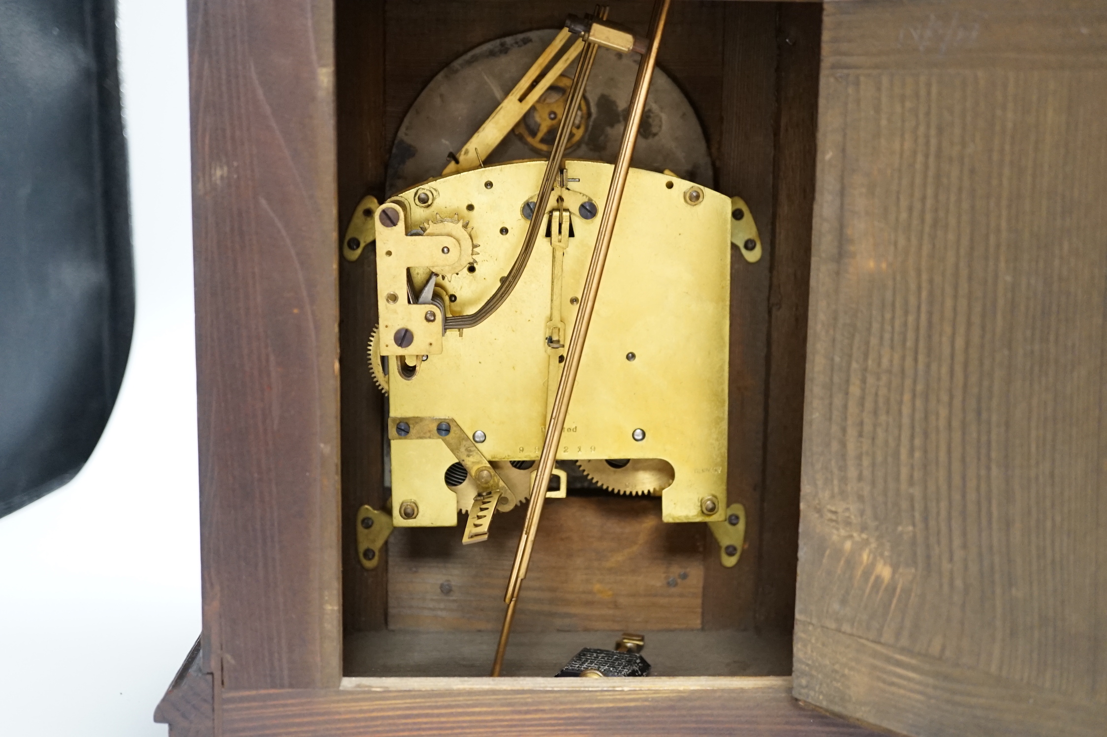 An early 20th century oak cased chimney mantel clock, 35cm